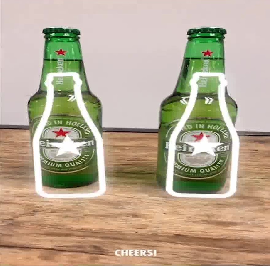 An image separated into three columns. The first column shows two Heineken F1 bottles with a white bottle icon overlayed on top. The second column shows a f1 car rising out of a table with the racing lights above. The third column shows an image of winning two tickets to a concert.
